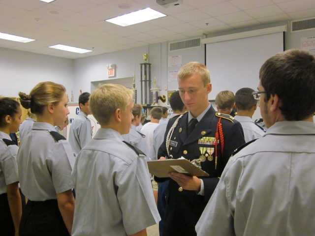 Platoon Sergeant Parnell inspects fourth squad on Uniform Day